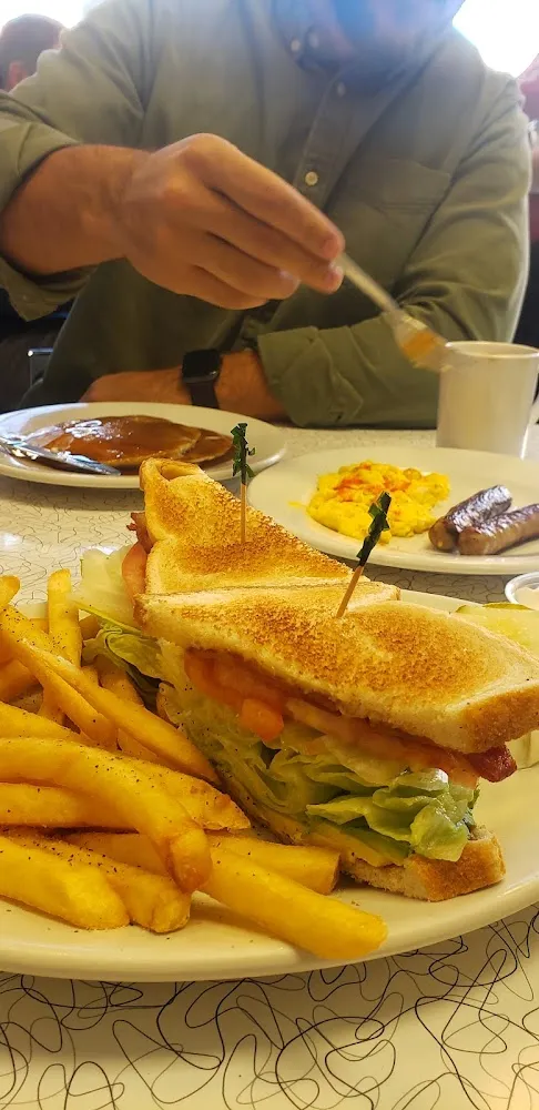 Pankakes Eggs Sausage Links blt and Fries
